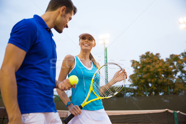 Two tennis player talking outdoors Stock photo © deandrobot