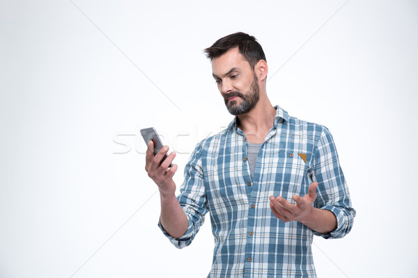 Man holding smartphone Stock photo © deandrobot