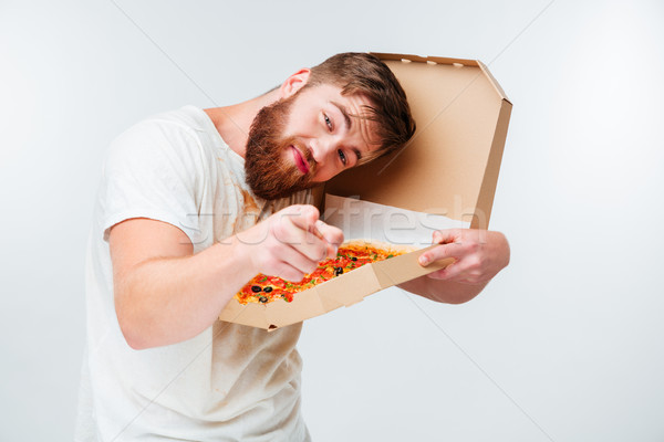 Funny barbado hombre caja de pizza senalando Foto stock © deandrobot