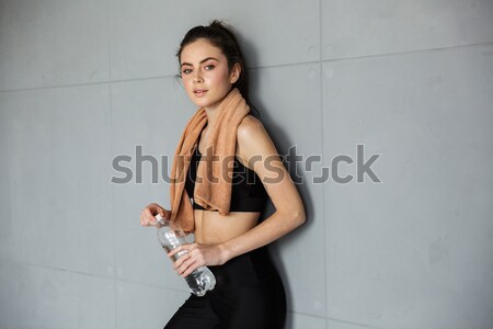 Side view of Beauty woman in suit and bra Stock photo © deandrobot