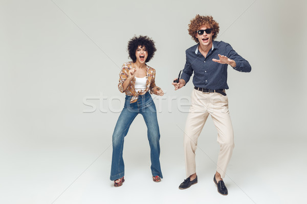 Emotional retro loving couple standing and posing Stock photo © deandrobot