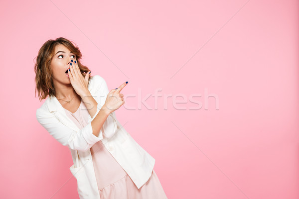 Portrait of a shocked young girl in Stock photo © deandrobot