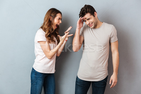 Portrait of an angry young couple having an argument Stock photo © deandrobot