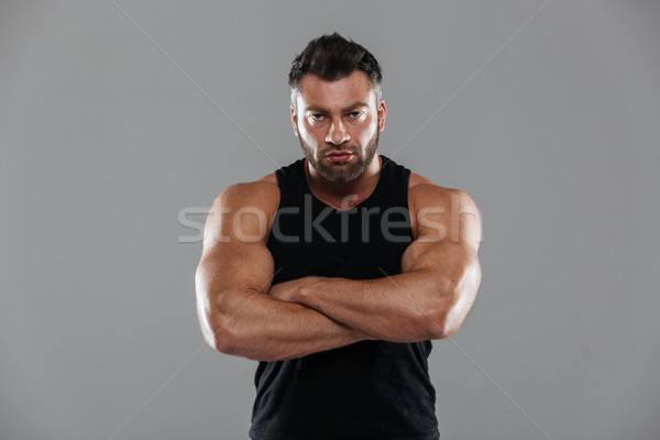 Retrato forte masculino musculação em pé brasão Foto stock © deandrobot