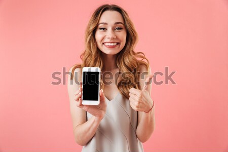 Glimlachende vrouw ogen tonen smartphone scherm glimlachend Stockfoto © deandrobot