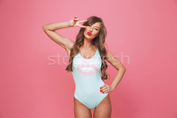 Portrait of a pretty young woman dressed in swimsuit Stock photo © deandrobot