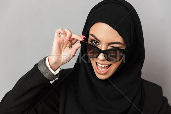 Portrait closeup of stylish muslim woman 20s in hijab smiling an Stock photo © deandrobot