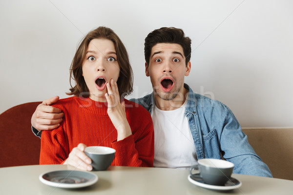 Caucasian woman and man expressing surprise with open mouth, whi Stock photo © deandrobot