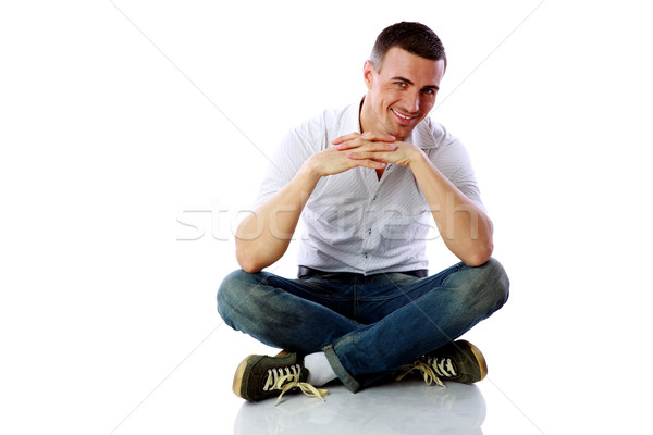 快樂 男子 坐在 地板 白 面對 商業照片 © deandrobot