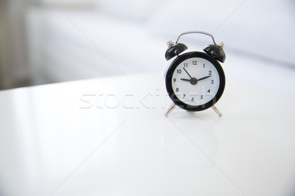 Stock photo: Classic style alarm clock on the table