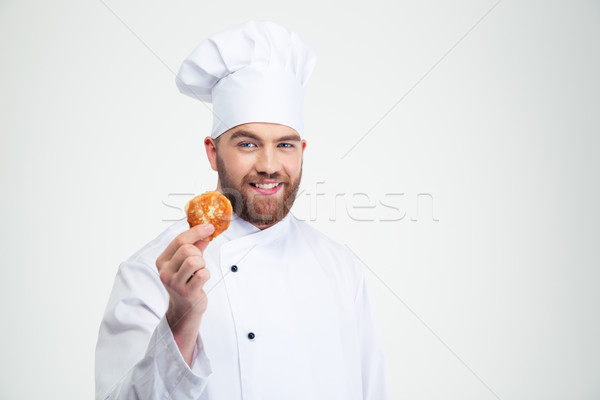 Happy male chef cook holding pancake  Stock photo © deandrobot