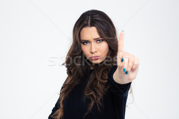 Girl showing disagree sign with finger Stock photo © deandrobot