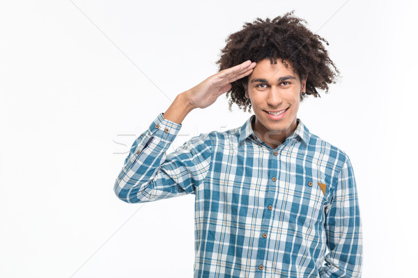 Happy afro american man saluting Stock photo © deandrobot