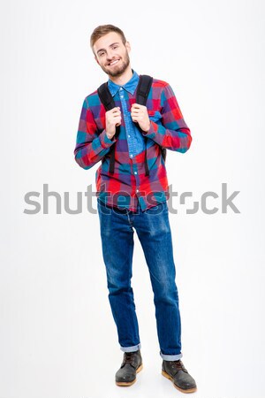Happy male student holding books Stock photo © deandrobot