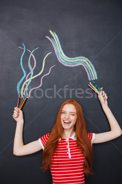 Charmant vrouw lachend tekening Blackboard vrolijk Stockfoto © deandrobot