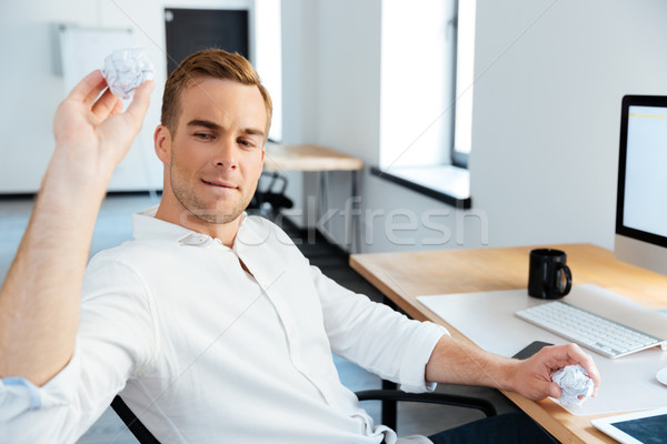 Businessman crumpling and throwing paper in offcie Stock photo © deandrobot