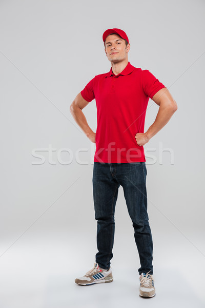 Full length portrait of deliveryman Stock photo © deandrobot