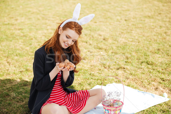 Portrait of a happy young woman with long ginger hair Stock photo © deandrobot