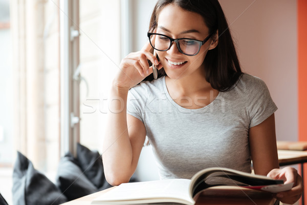 Caucasian pretty woman indoors talking by mobile phone Stock photo © deandrobot