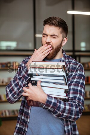 Sonriendo masculina estudiante libros Foto stock © deandrobot