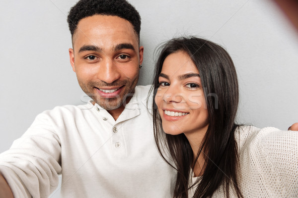 Smiling loving couple make selfie. Stock photo © deandrobot