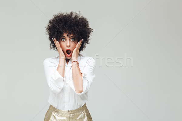 Shocked retro lady dressed in shirt Stock photo © deandrobot