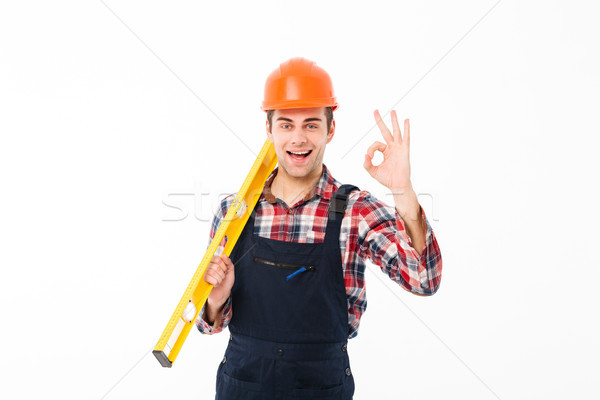 Full length portrait of a successful young male builder Stock photo © deandrobot