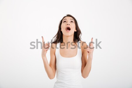 Portrait of a shocked girl dressed in tank-top Stock photo © deandrobot
