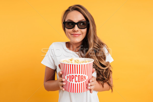 Portrait of a pleased happy girl in 3d glasses Stock photo © deandrobot