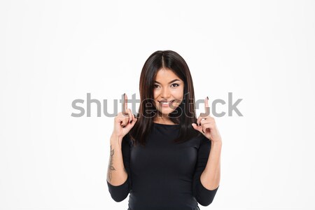 Portrait of a cheerful smiling woman giving thumbs up Stock photo © deandrobot