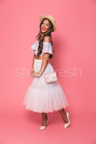Full length portrait of adorable fashion woman 20s wearing straw Stock photo © deandrobot