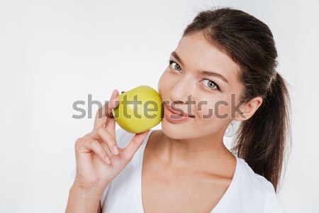 Attractive woman with skincare holding apple Stock photo © deandrobot