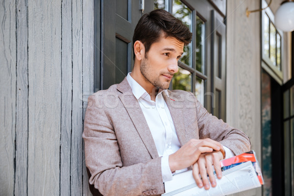 Close-up portrait of man looking at his watch outdoors Stock photo © deandrobot