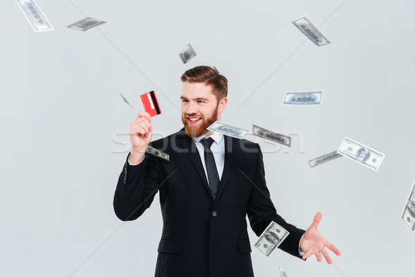 Homme d'affaires carte relevant argent heureux barbu [[stock_photo]] © deandrobot