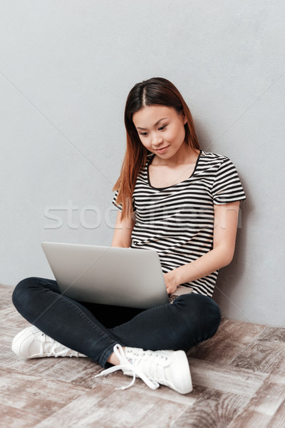 Hardworking woman working with laptop Stock photo © deandrobot