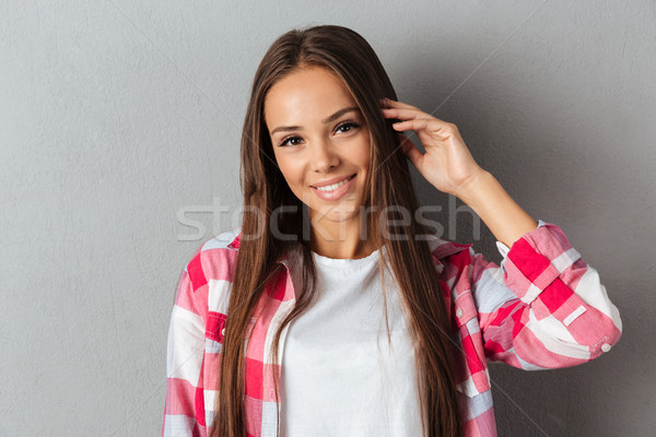 Photo joli souriant fille à carreaux [[stock_photo]] © deandrobot