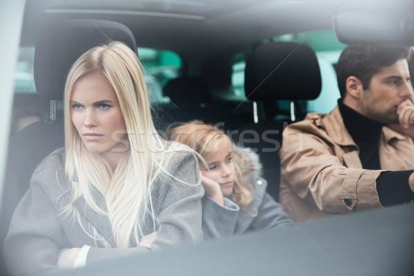 Angry displeased young family sitting in car after quarrel Stock photo © deandrobot