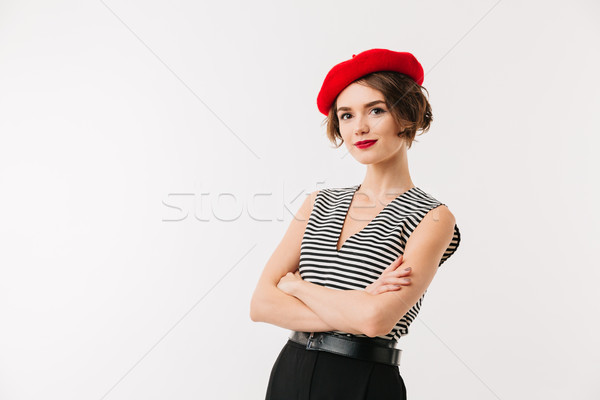 Portret glimlachende vrouw Rood beret permanente armen Stockfoto © deandrobot