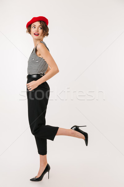Full length portrait of a cheery woman Stock photo © deandrobot