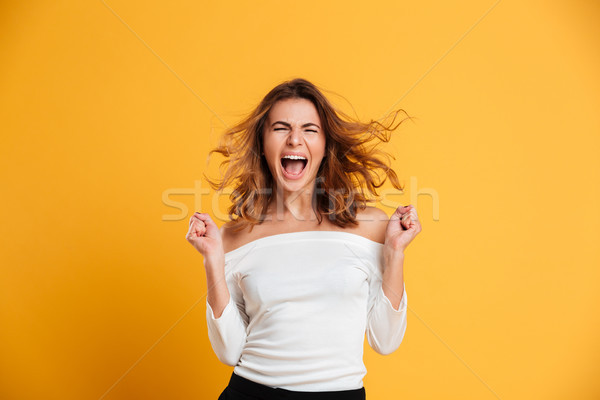 Gritando mulher jovem isolado foto amarelo Foto stock © deandrobot