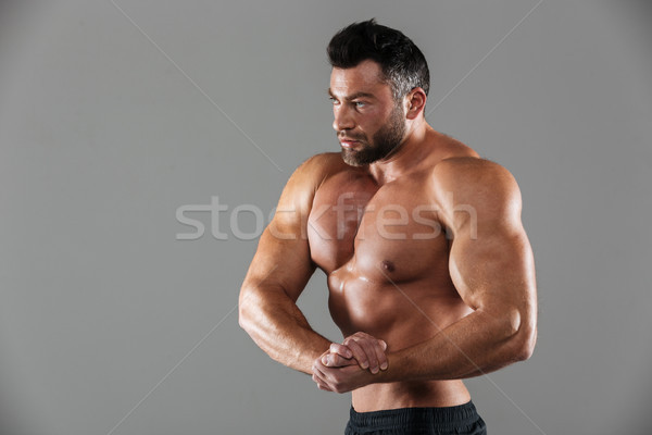 Stock photo: Portrait of a muscular strong shirtless male bodybuilder