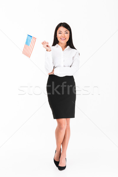 Full length portrait of a smiling asian businesswoman Stock photo © deandrobot