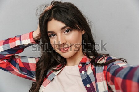 Portré csinos lány kockás póló tart Stock fotó © deandrobot