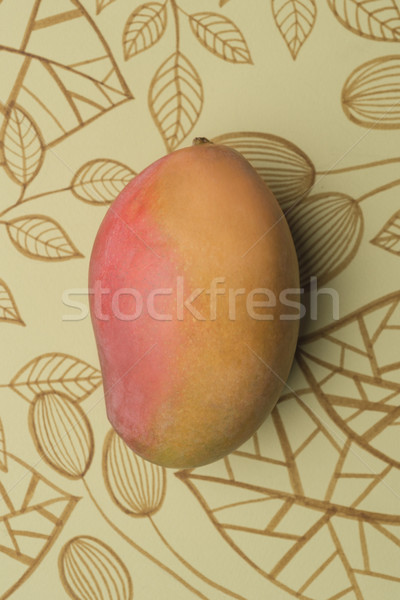 Mango fruit over outline floral background Stock photo © deandrobot