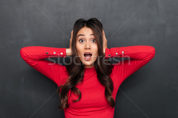 Geschokt brunette vrouw Rood blouse oren Stockfoto © deandrobot