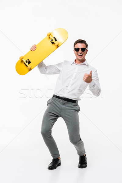 Full length portrait of a happy successful man Stock photo © deandrobot