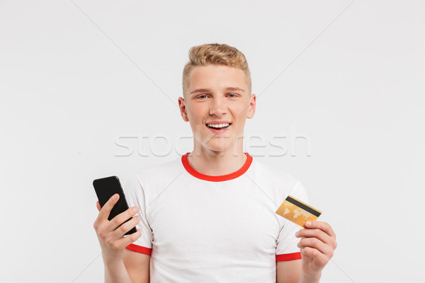 Image of smiling teenage man having clean healthy skin wearing c Stock photo © deandrobot