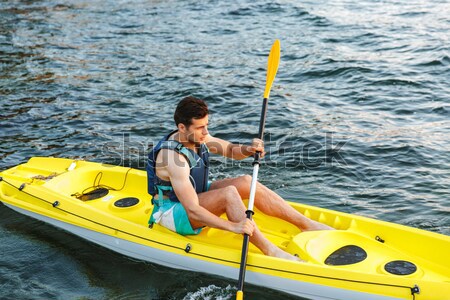 Man paddling a kayak Stock photo © deandrobot