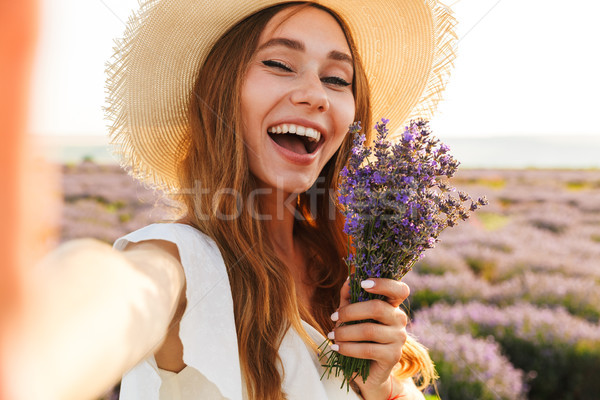 Feliz jovem chapéu de palha lavanda buquê Foto stock © deandrobot