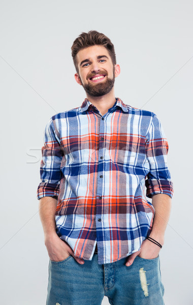 Portrait of a smiling young man Stock photo © deandrobot